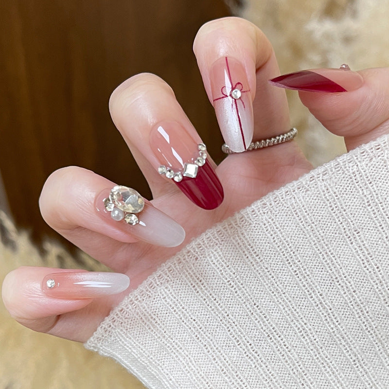 Elegant Winter Wonderland Ombre Long Oval Red and Clear with Shimmering Jewel Accents Press on Nail Set
