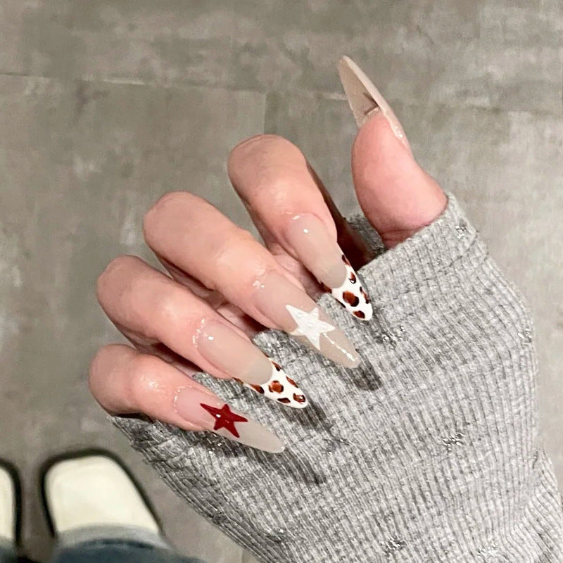 Celestial Dreams Long Almond Beige Nails with Star Accents and Unique Animal Print Design