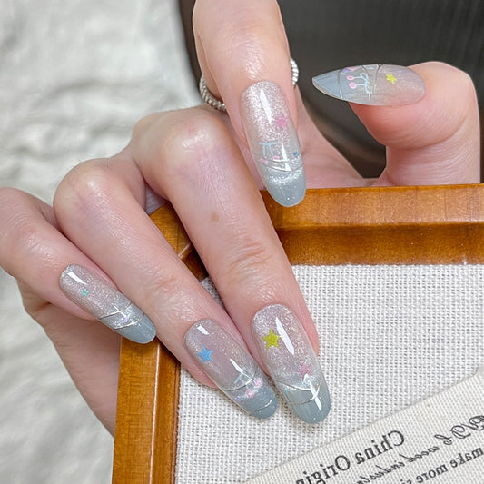Celestial Dreamscape Long Almond Shaped Glittery Grey Press On Nail Set with Colorful Star Accents