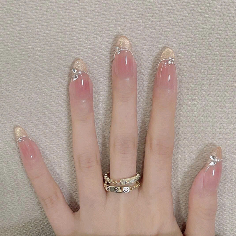 Enchanting Elegance Long Oval Beige with Gold Glitter Tips and Delicate Rhinestone Accents Nail Set