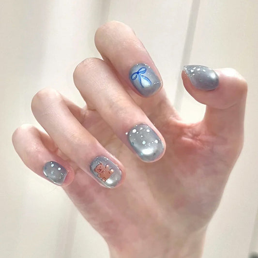 Whimsical Winter Wonderland Press On Nail Set Short Squoval Gray with Snowflake and Ribbon Design