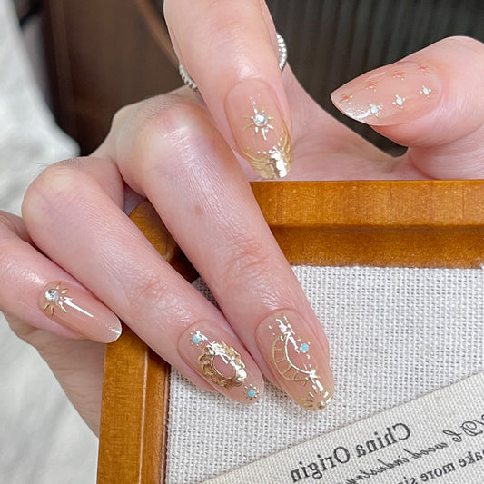 Celestial Dream Press On Nail Set Medium Oval Clear with Gold Accents and Sparkling Gem Details