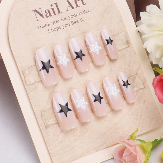 Celestial Glamour Medium Oval Beige Press On Nail Set with Chic Black Stars and Sparkling Accents