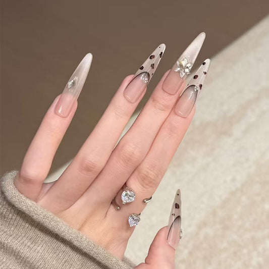 Whimsical Wonderland Long Stiletto Beige Nail Set with Chic Gemstone Accents