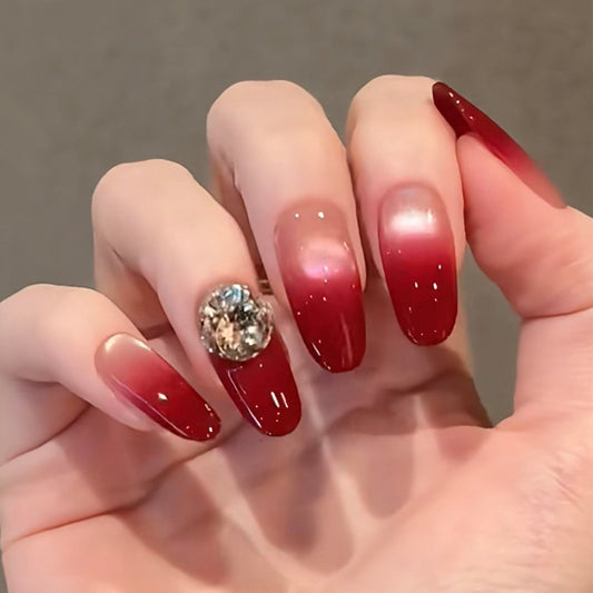 Glamorous Gradient Long Squoval Red Nails with Sparkling Accent Gemstone