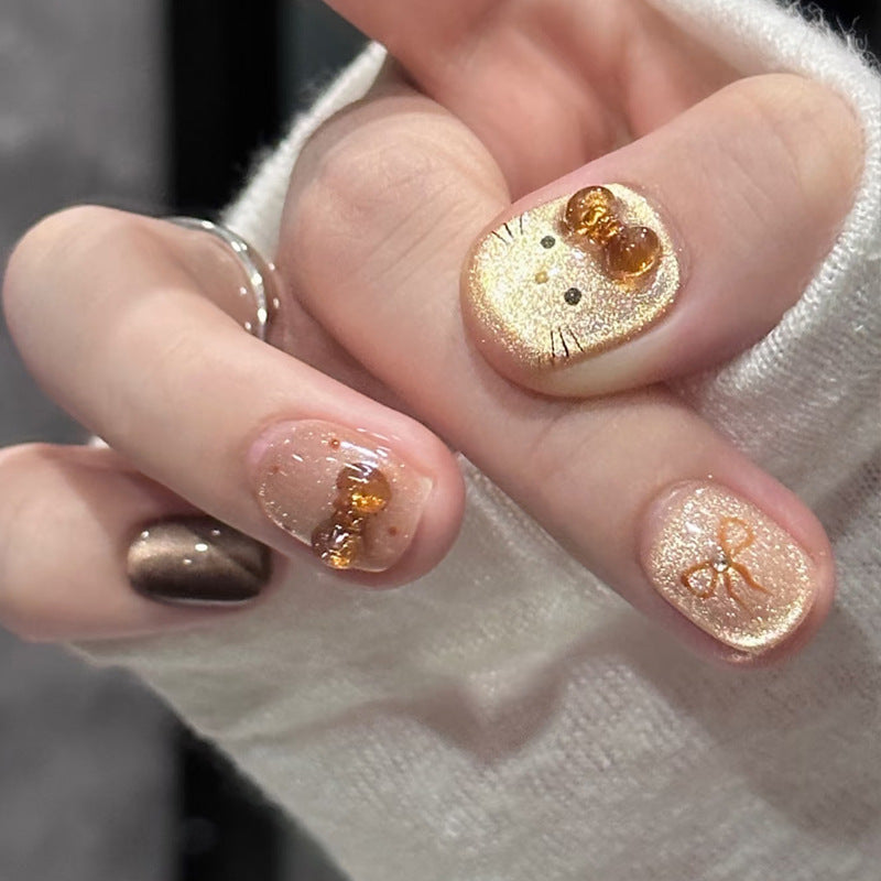 Whimsical Charm Short Squoval Gold Glitter Press On Nail Set with Adorable Bow and Kitty Design