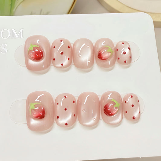 Whimsical Strawberry Dream Short Squoval Pink Press On Nail Set with Delicate Fruit Accents and Shimmering Finish