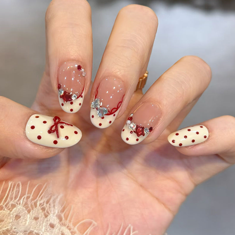Charming Polka Dot Short Oval Creamy White Nails with Elegant Embellishments