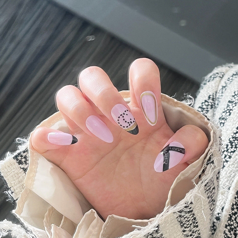 Chic Pastel Elegance Medium Almond Shape Soft Pink with Unique Geometric Accents Press On Nail Set