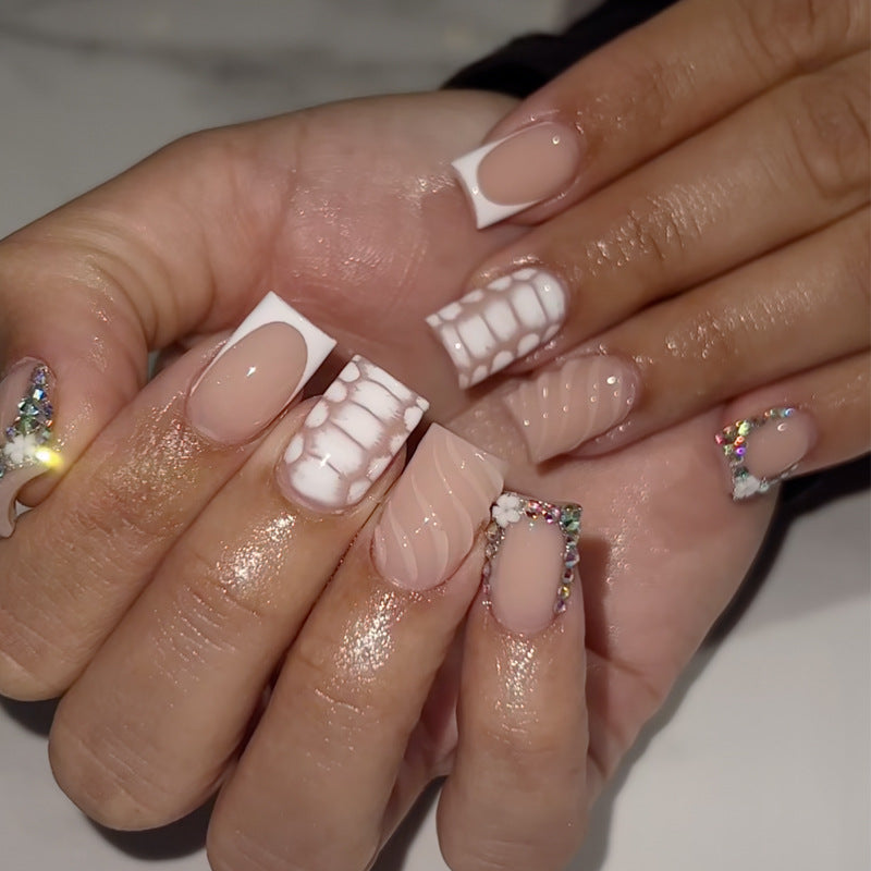 Elegant Garden Inspired Short Square White and Beige Nails with Unique Textured Designs and Shimmering Rhinestone Accents