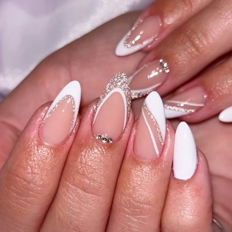 Elegant Serenity Long Stiletto White Nails with Glittering Accents and Unique Design