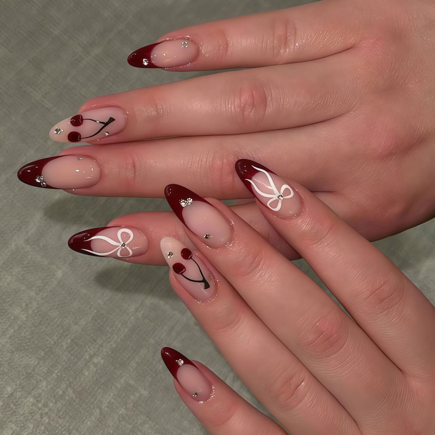 Cherry Blossom Elegance Long Almond Burgundy Press On Nail Set with Enchanting Floral Designs and Sparkling Accents