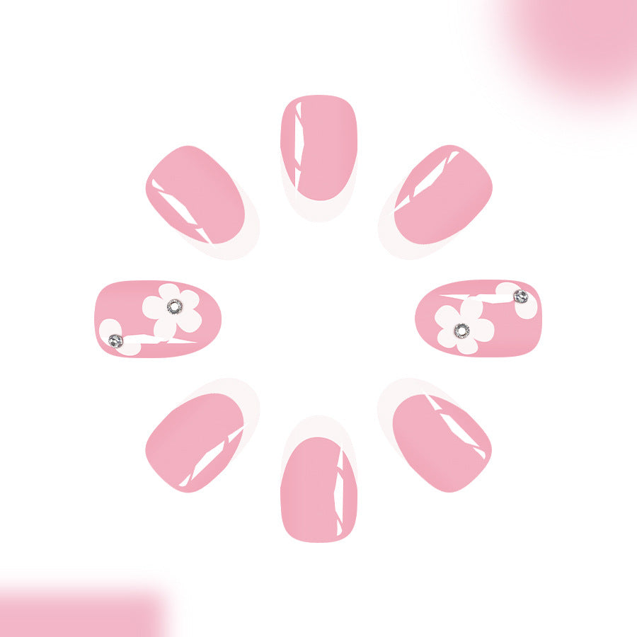 Blossoming Elegance Medium Oval Soft Pink Press On Nail Set with Floral Accents and Sparkling Gems