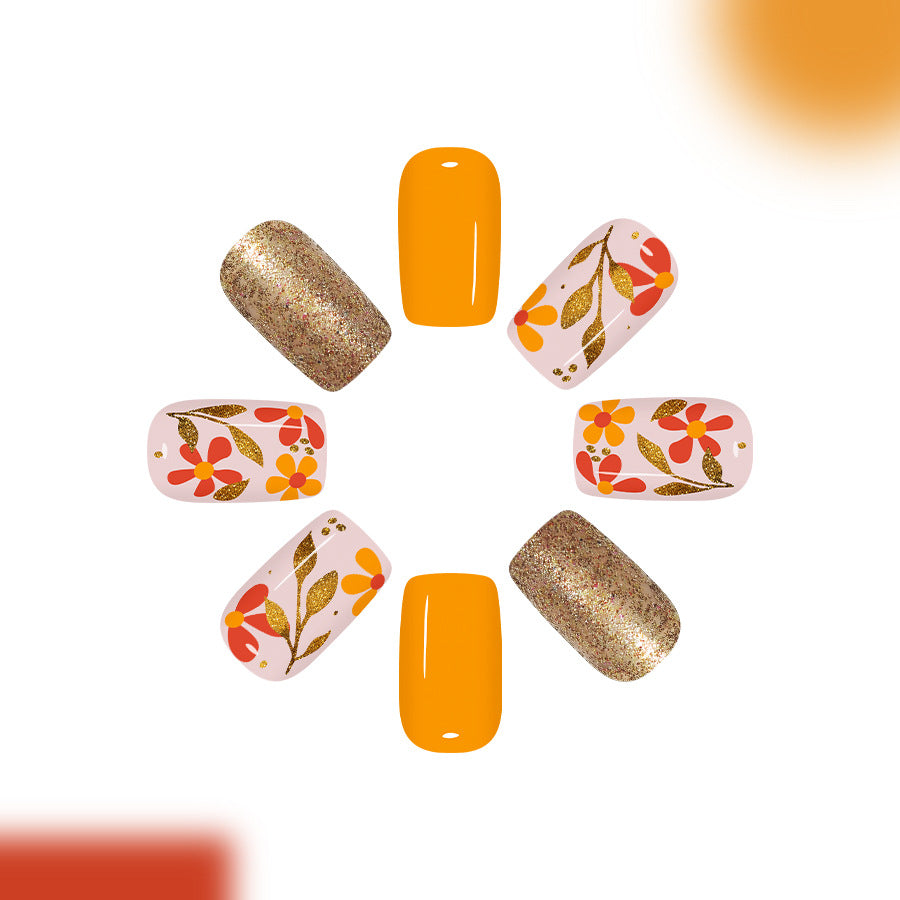 Bohemian Bliss Press On Nail Set Featuring Medium Length Square Shape Bright Yellow Color with Floral and Glitter Accents