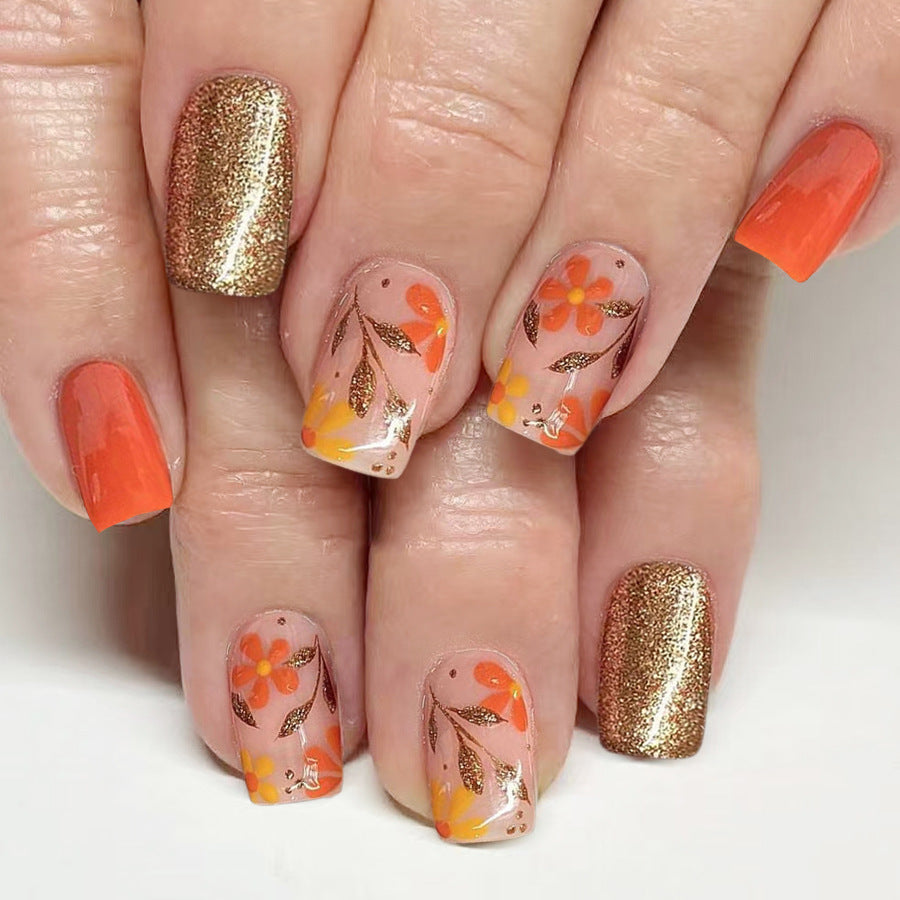 Floral Harmony Medium Square Press On Nail Set in Orange and Glittering Gold with Vibrant Flower Accents