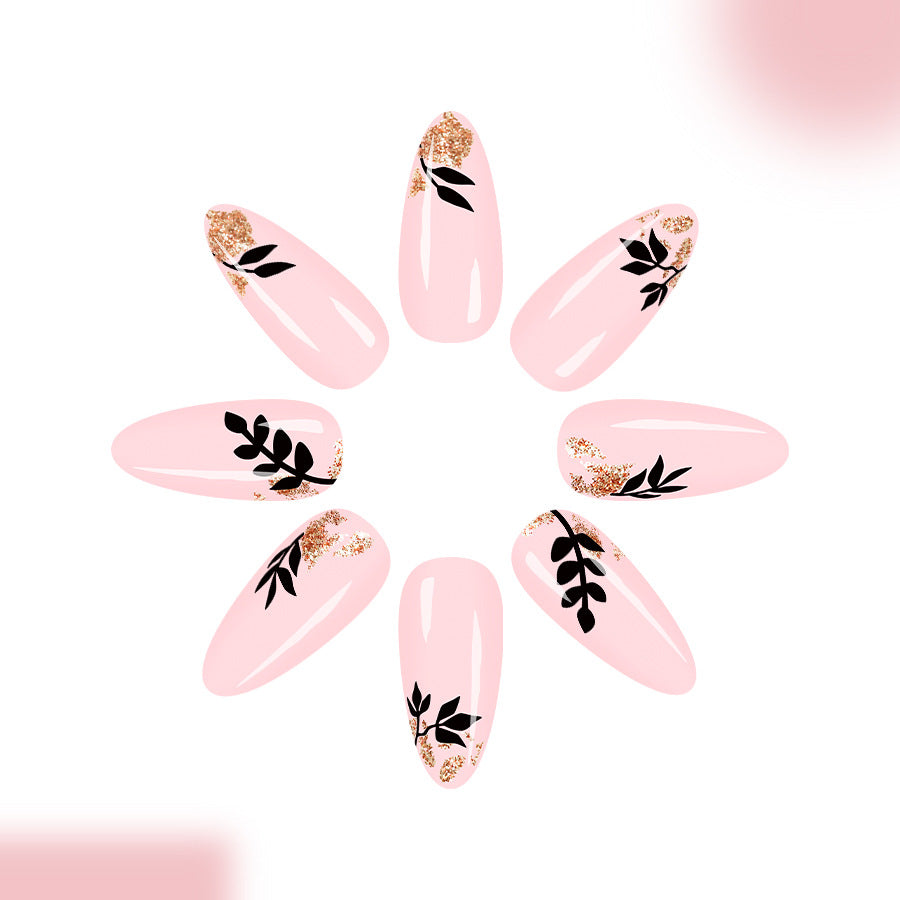 Chic Blossom Elegant Long Almond Pink Nails with Leaf Print and Glitter Accent