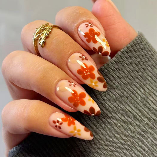 Boho Chic Long Almond-Shaped Press-On Nail Set in Translucent Orange with Whimsical Floral Design