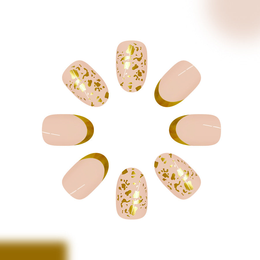 Glamorous Safari Inspired Medium Oval Beige Nails with Gold Animal Print Accent