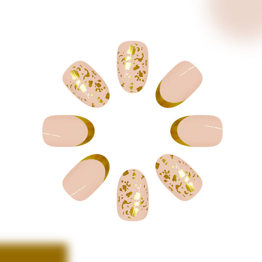 Glamorous Safari Inspired Medium Oval Beige Nails with Gold Animal Print Accent