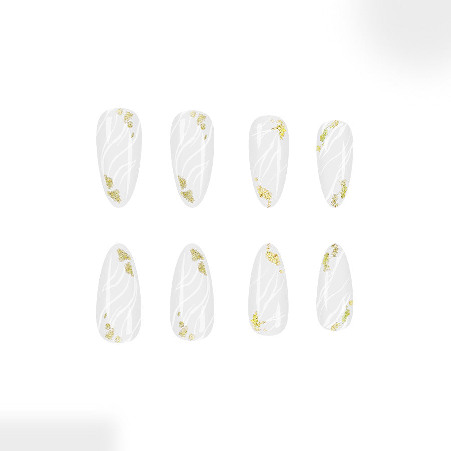 Whimsical Forest Inspired Long Almond Shaped Clear White Nails with Delicate Gold Floral Accents