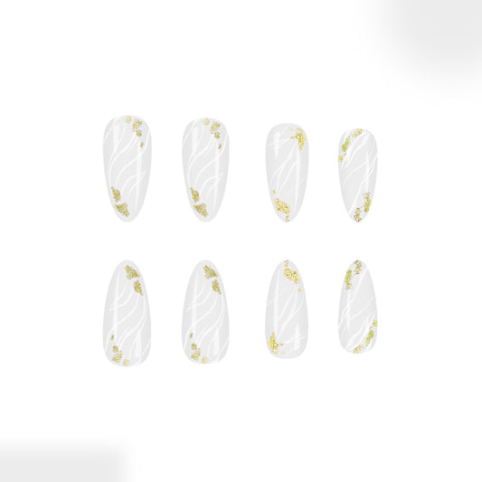 Whimsical Forest Inspired Long Almond Shaped Clear White Nails with Delicate Gold Floral Accents