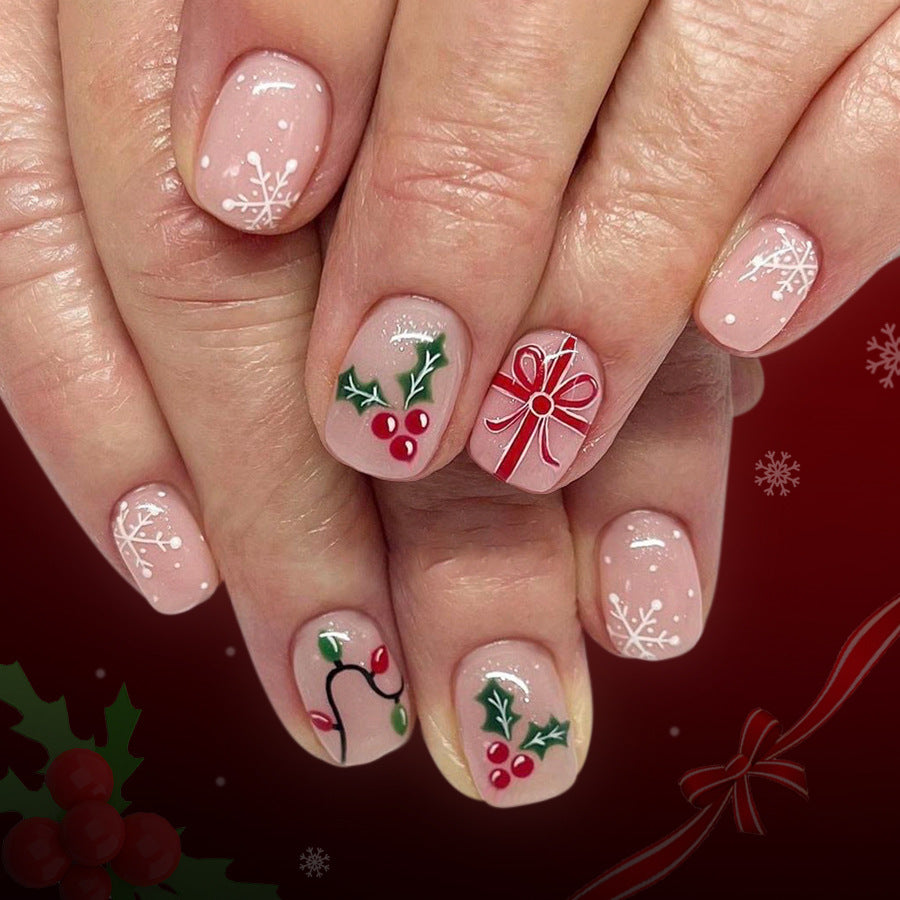 Holiday Cheer Short Round Blush Pink Press On Nail Set with Festive Snowflakes and Holly Designs