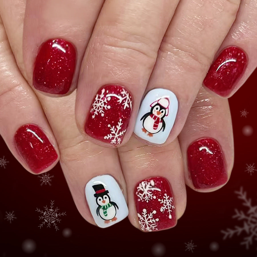Winter Wonderland Red Square Short Press-On Nail Set with Glittery Snowflakes and Adorable Penguin Art