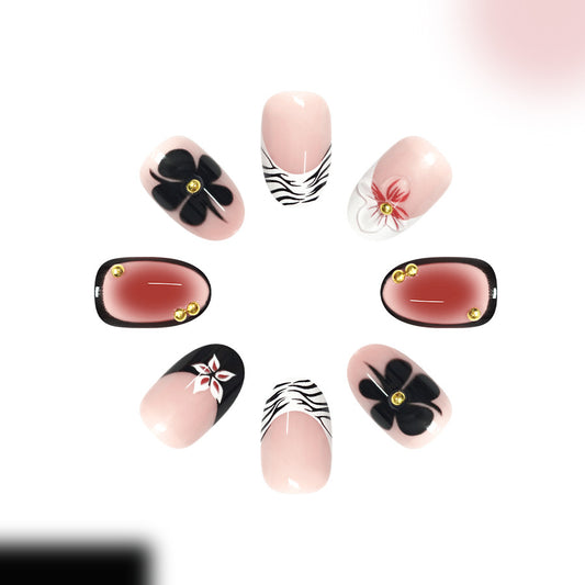 Chic Floral Fantasy Medium Oval Pink and Black Nail Set with Unique Gold Accents
