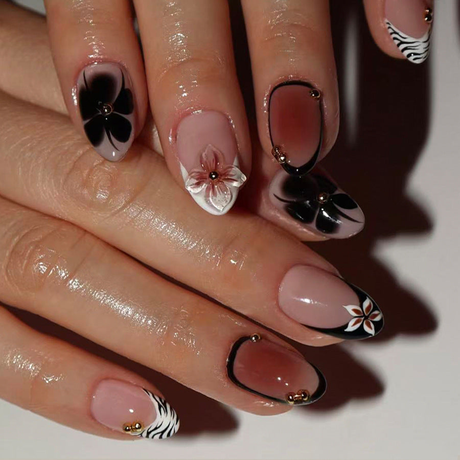 Botanical Bliss Elegant Medium Almond Shaped Soft Pink and Black Floral Press On Nail Set with Unique Gold Accents