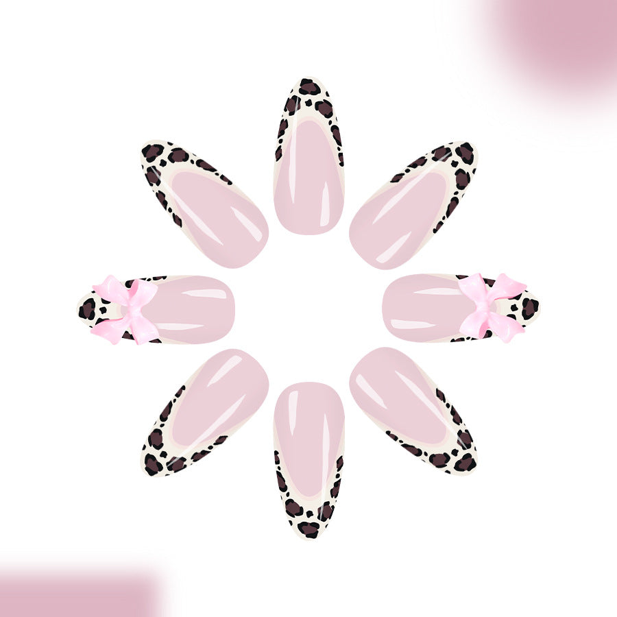Safari Chic Long Almond Pink Nails with Leopard Print Tips and Cute Bow Accents