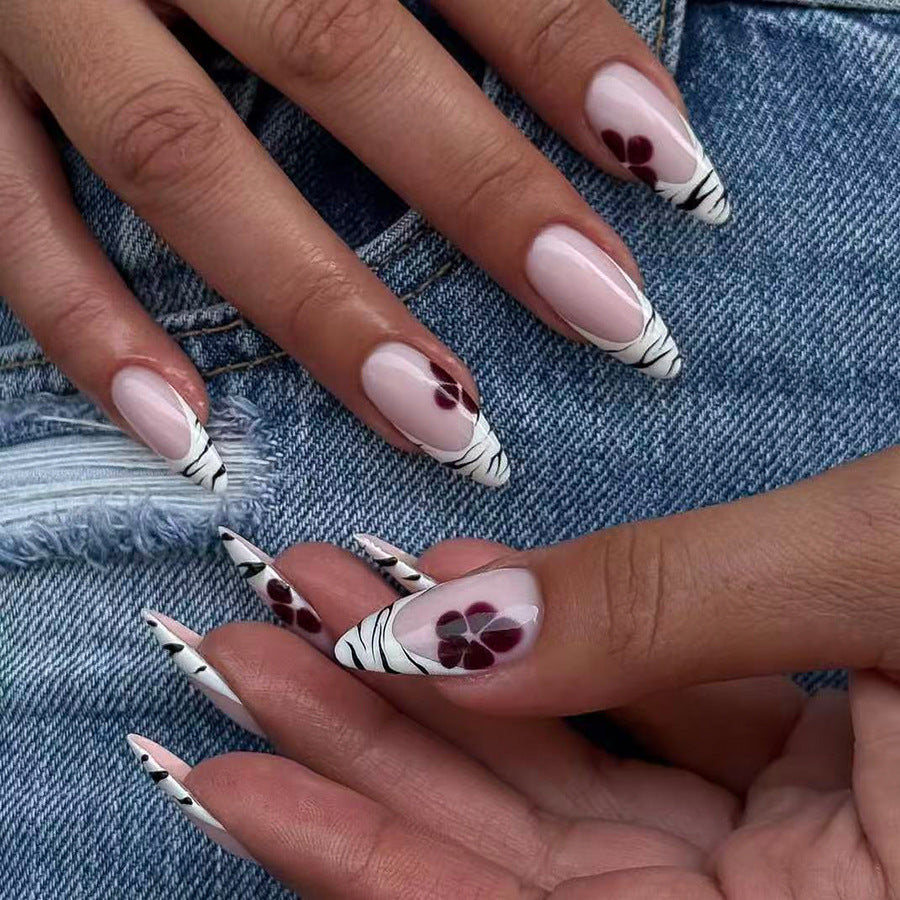 Floral Fantasy Long Almond White and Black Press On Nail Set with Intricate Flower Design