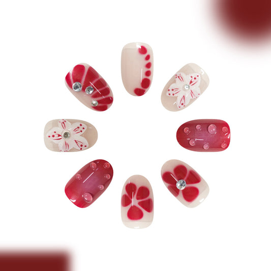 Enchanting Blossom Inspired Press on Nail Set Medium Oval Soft Pink and Bold Red Featuring Floral Accents and Sparkling Gems