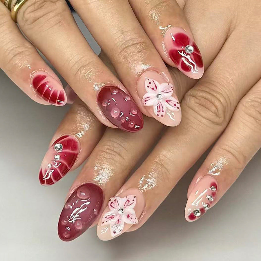 Floral Elegance Long Almond Red and Pink Press On Nail Set with Intricate Floral Designs and Gem Accents