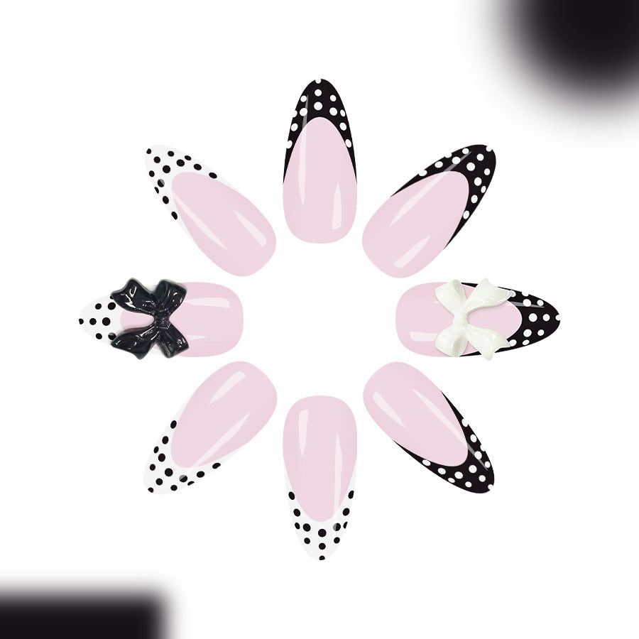 Charming Bowtiful Press On Nail Set Long Almond Pink with Black Polka Dots and Stylish Bow Embellishments