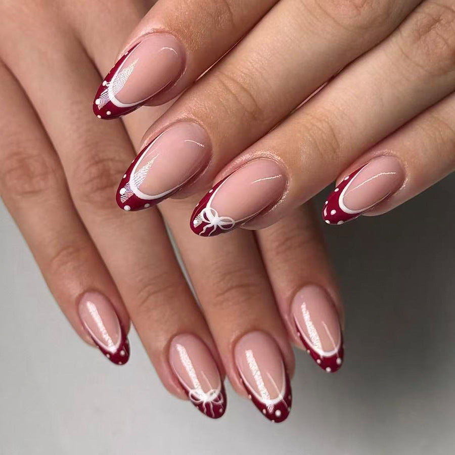 Chic Elegance Long Almond Burgundy Nails with Whimsical White Bow Accents