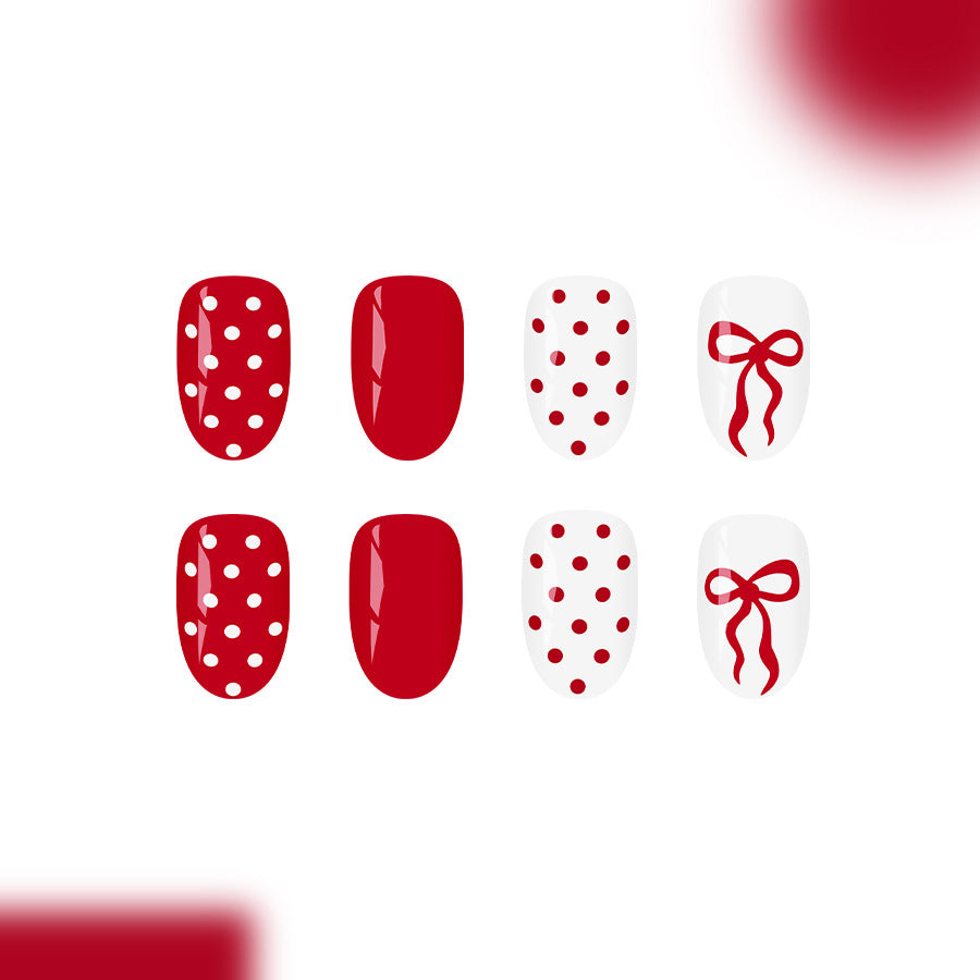 Festive Charm Red Short Oval Press On Nail Set with Polka Dots and Bow Design