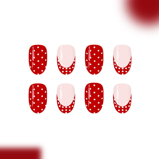 Festive Flair Red Short Oval Nails with Whimsical Polka Dots