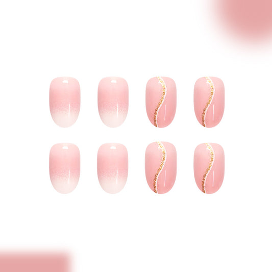 Elegant Blossom Press On Nail Set in Medium Oval Soft Pink with Dazzling Gold Accent Detail