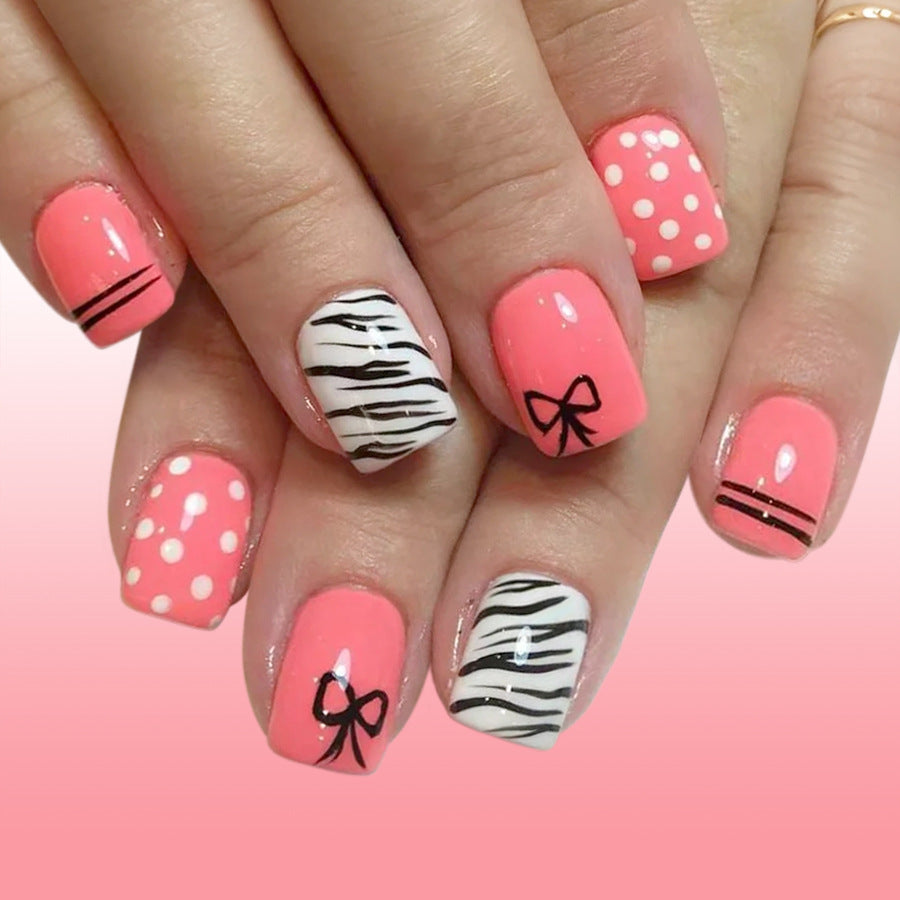 Playful Glamour Short Square Coral Nails with Stylish Patterns and Cute Bows