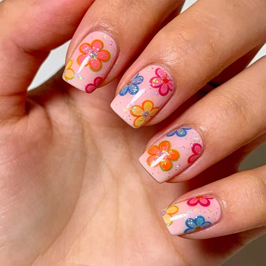 Whimsical Floral Short Square Pink Nails with Glitter Accents