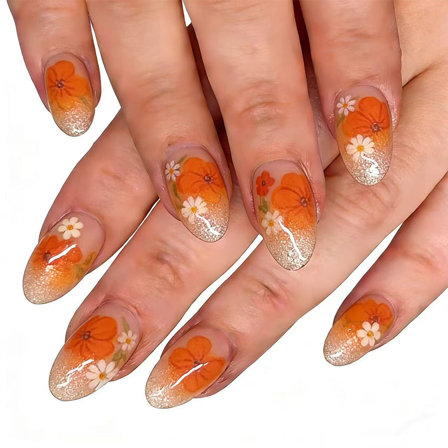 Floral Delight Medium Round Orange Ombre with Glitter and Flower Accents Nail Set
