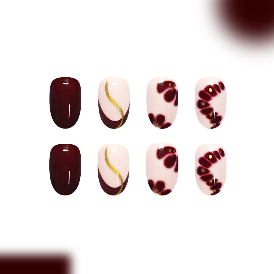 Elegant Floral Charm Medium Oval Burgundy Press On Nail Set with Glitter Accents