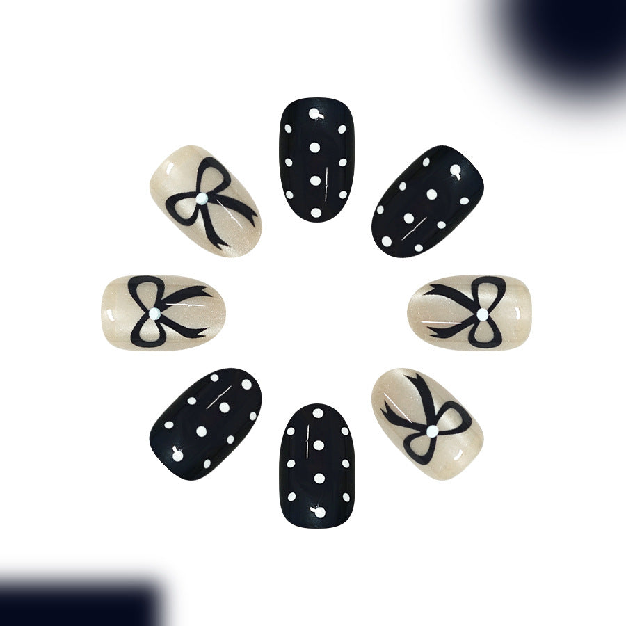 Chic Polka Dot Themed Short Oval Black and Beige Nail Set with Elegant Bow Design