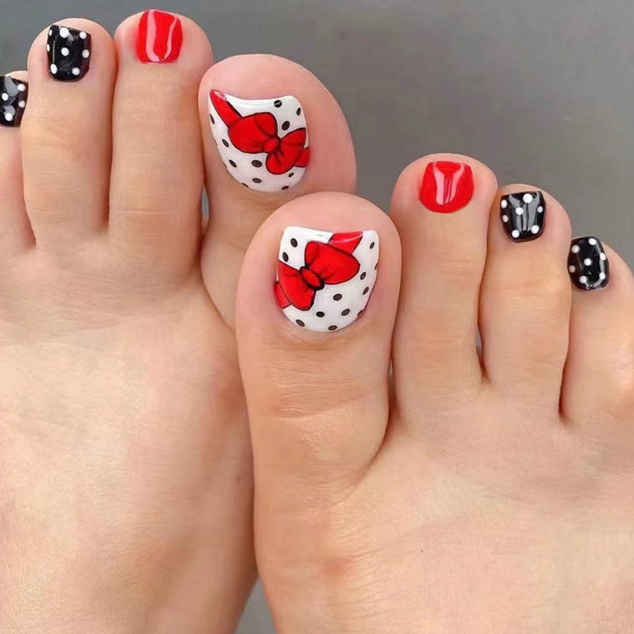 Polka Dot Party Short Length Oval Press On Nail Set in Classic Red, White, and Black with Chic Bow Accents