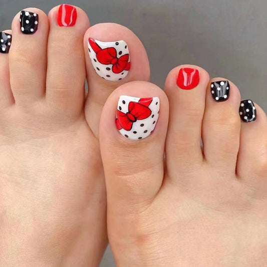 Polka Dot Party Short Length Oval Press On Nail Set in Classic Red, White, and Black with Chic Bow Accents