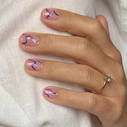 Elegant Lavender Swirls Short Oval Beige Press On Nail Set with Subtle Artistic Accents