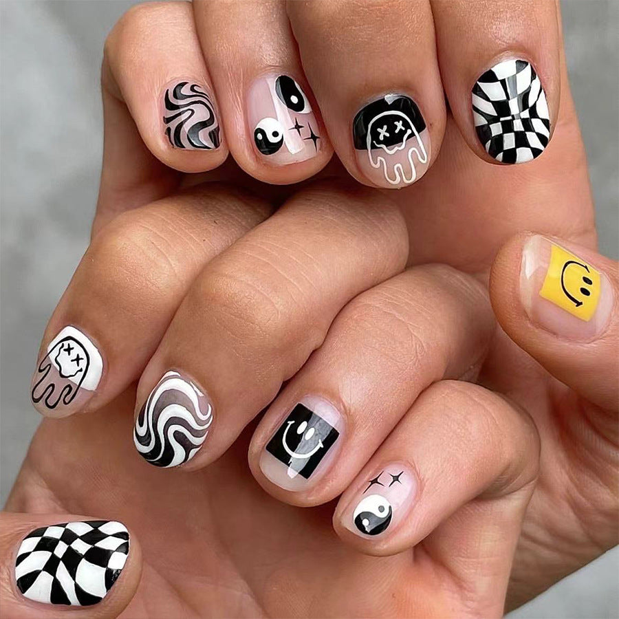 Monochrome Magic Short Length Oval Press On Nail Set with Playful Emoticon Accents in Black, White & Yellow