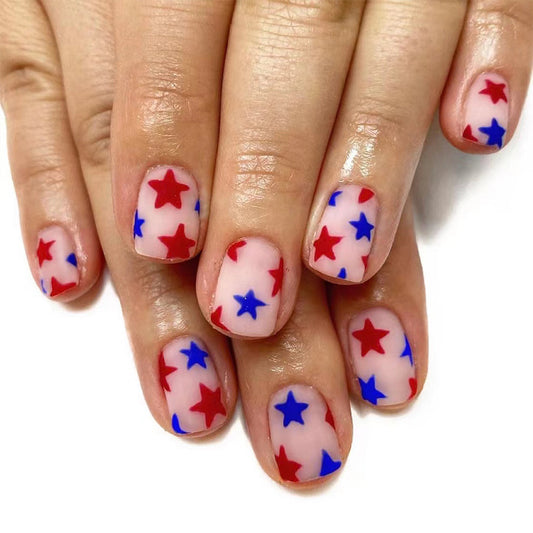 Festive Short Oval Press On Nails in Red and Blue with Translucent Star Patterns