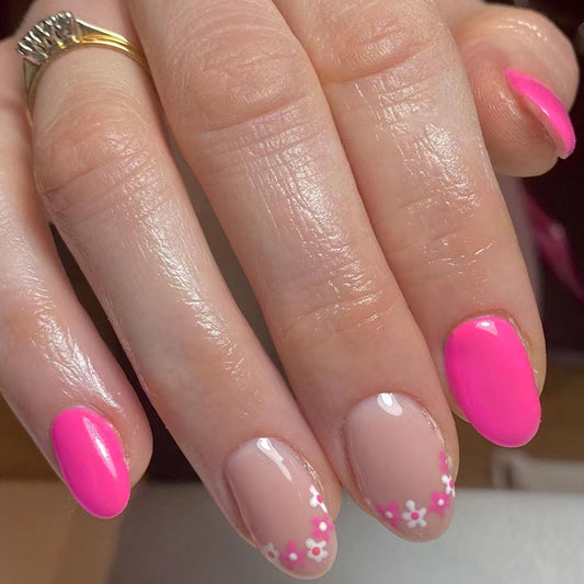 Pink Petal Parade Medium Oval Press On Nails in Sheer Beige and Vibrant Pink with Floral Tips