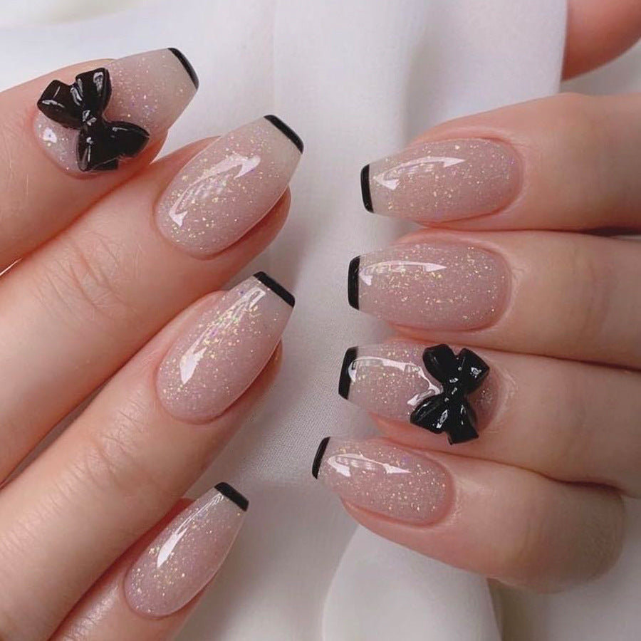Elegant Charm Long Coffin Beige Glitter Press On Nail Set with Black Accents and Butterfly Embellishments